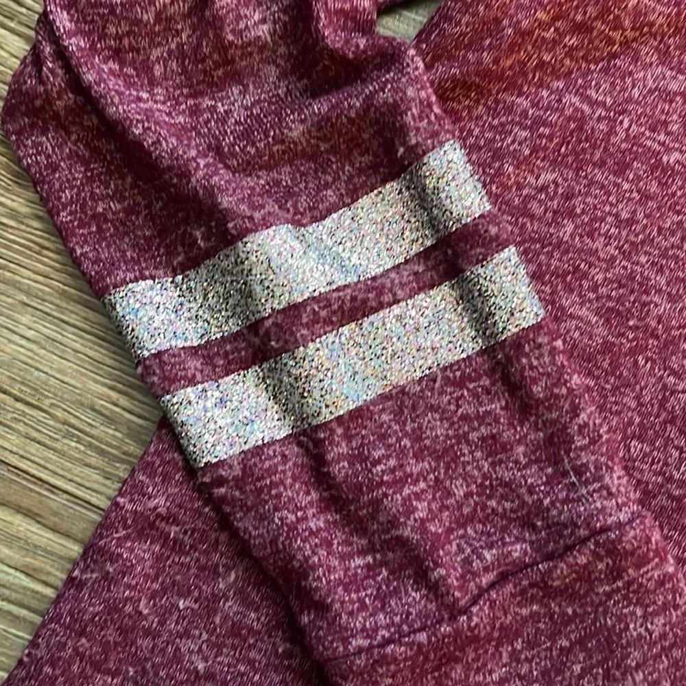 Justice heathered burgundy hooded top with silver glitter rings on sleeve